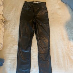Brand new vegan leather pants with crossover button.